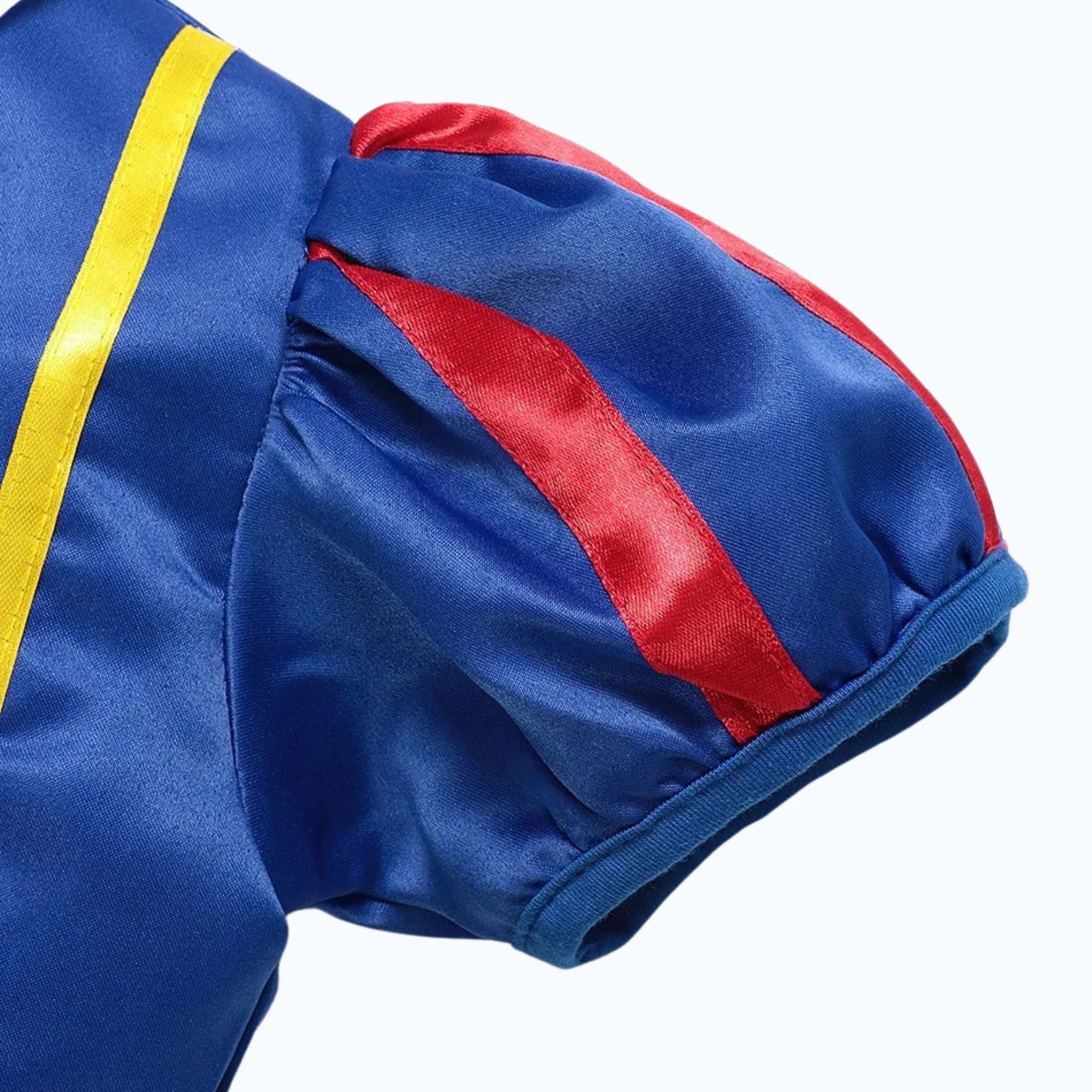 Close-up of puffy blue sleeve with red ribbon trim on princess-style dress for children.