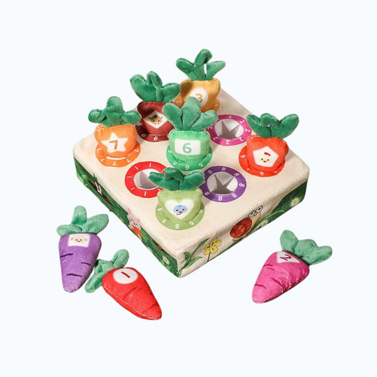 Soft Montessori carrot pull toy with colorful numbered carrots and a wooden sorting board for toddlers.
